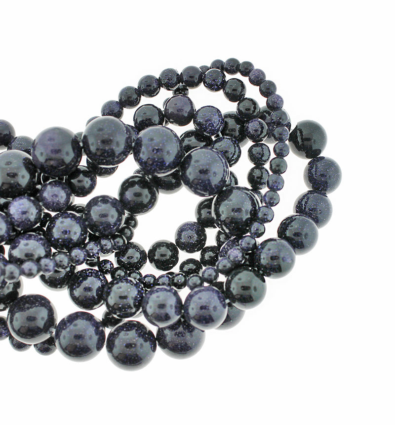 Perles rondes en pierre dorée naturelle 4 mm - 12 mm - Bleu nuit - 1 brin complet de 15,5" - BD1835