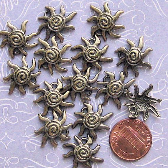 8 Sun Antique Bronze Tone Charms - BC213